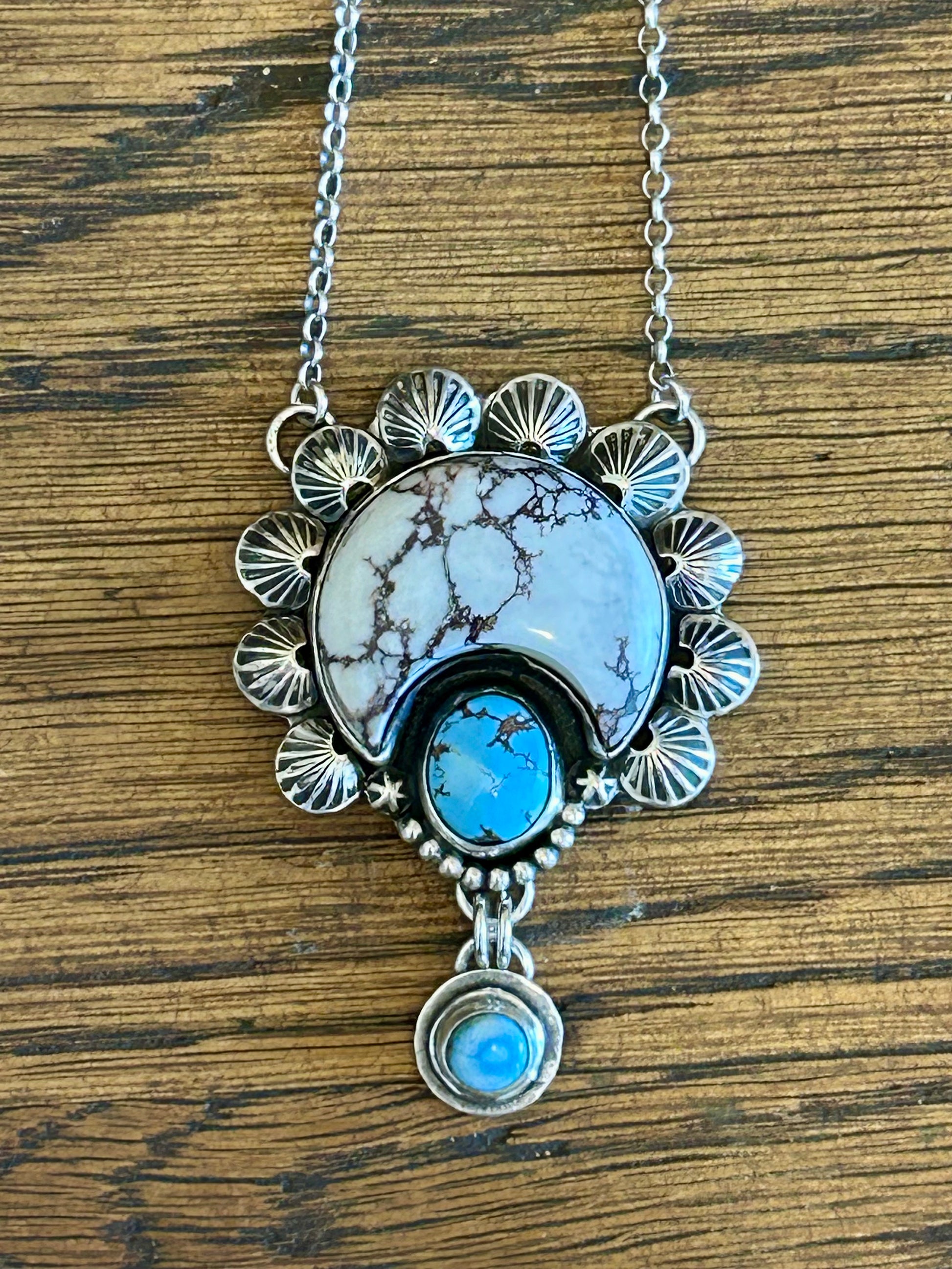 Golden hills turquoise and wild horse magnesite set in sterling silver accented with sterling hand stamped embelishments.