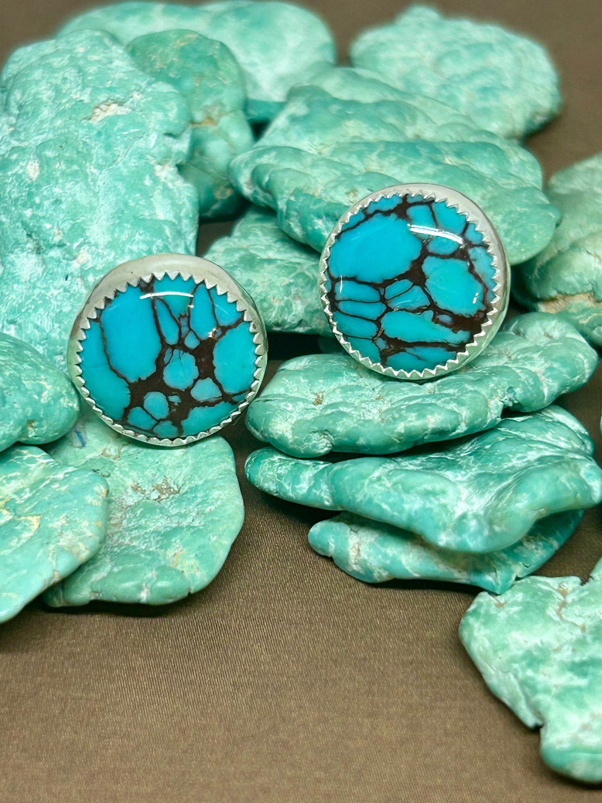Round Egyptian turquoise 1/4th of an inch in diameter set in sterling silver with a shiny finish.