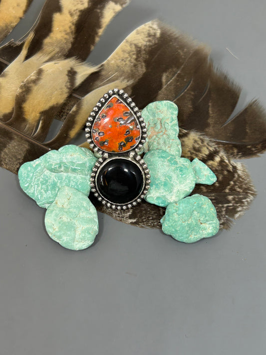 Natural LAva JAster and Black Sheen Obsidian set in sterling silver accented with bead wire on a double band size 9 ring shank.