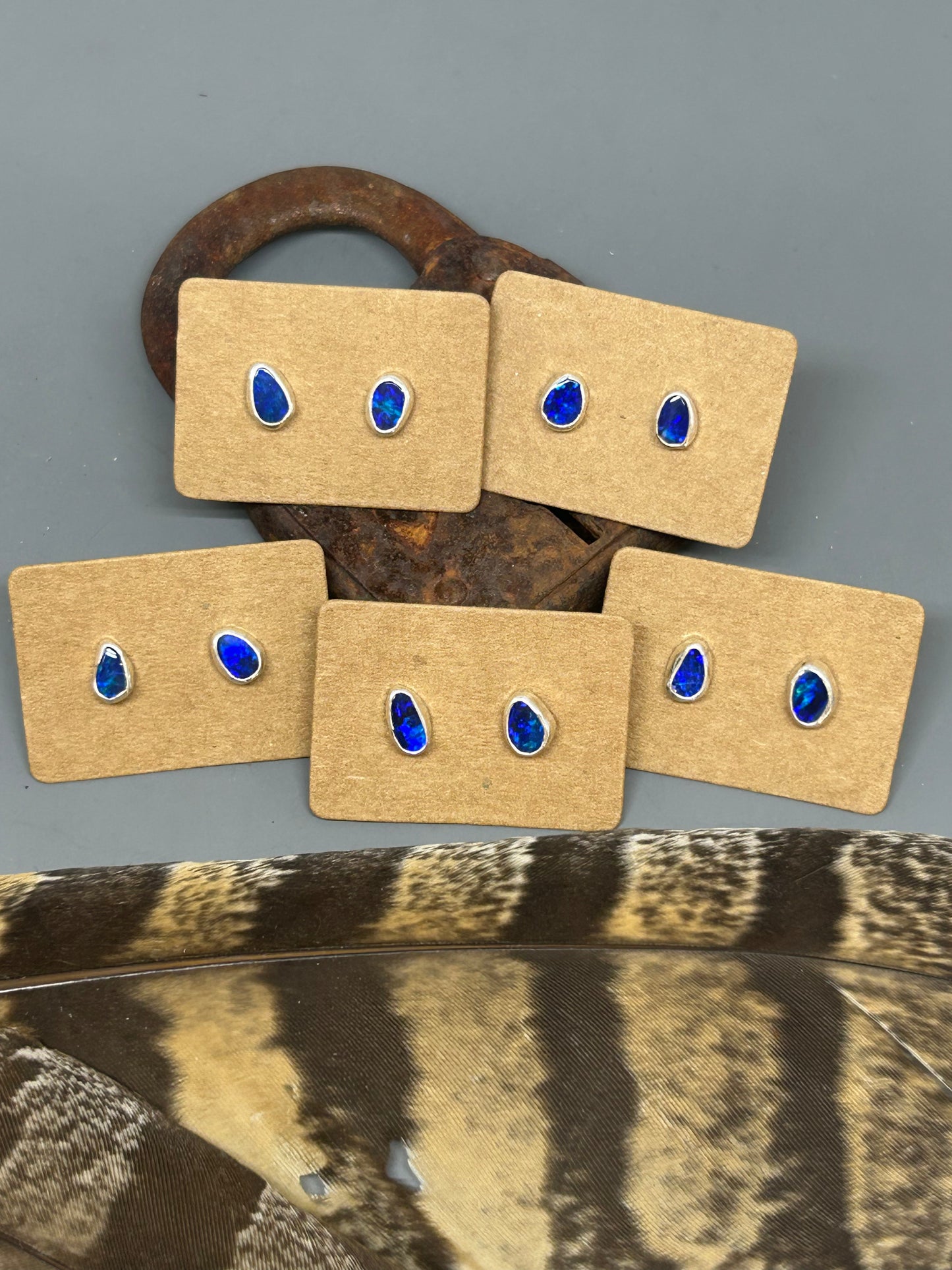 Asymmetrical Opal doublets set in sterling silver with silver posts and ear backs.