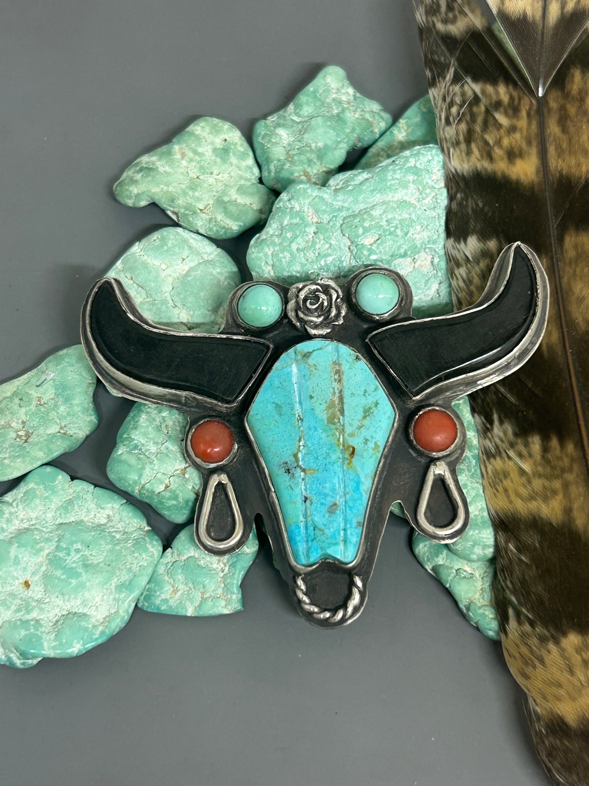 kingman turquoise and ox bone set in sterling silver in a longhorn setting accented with bamboo coral, Royston turquoise and stelring accents.