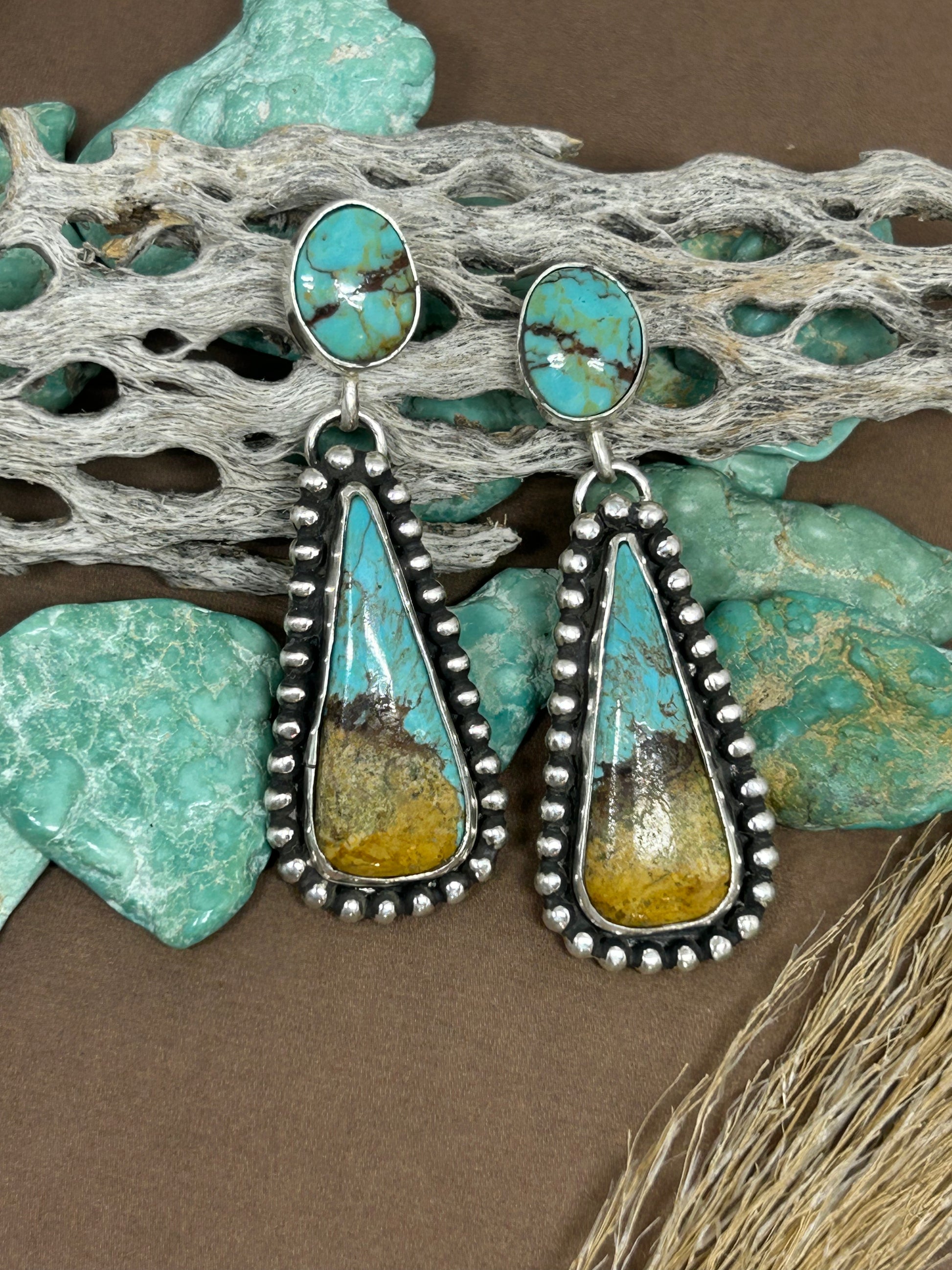 Glacier blue turquoise and Kingman turquoise set in sterling silver with a soft patina.
