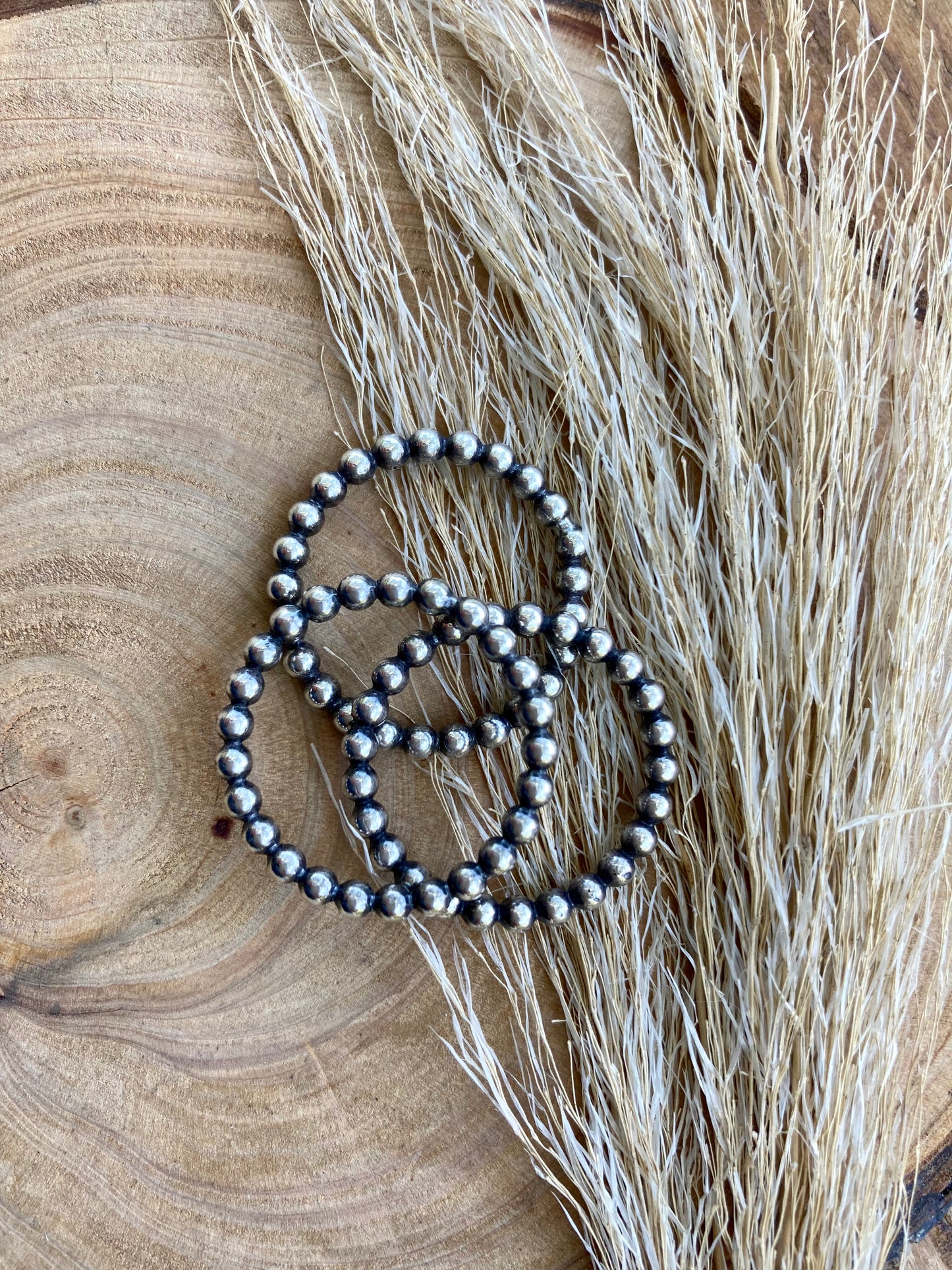 Sterling silver bead wire rings with soft patina.  Simple minimalist style stacking rings.