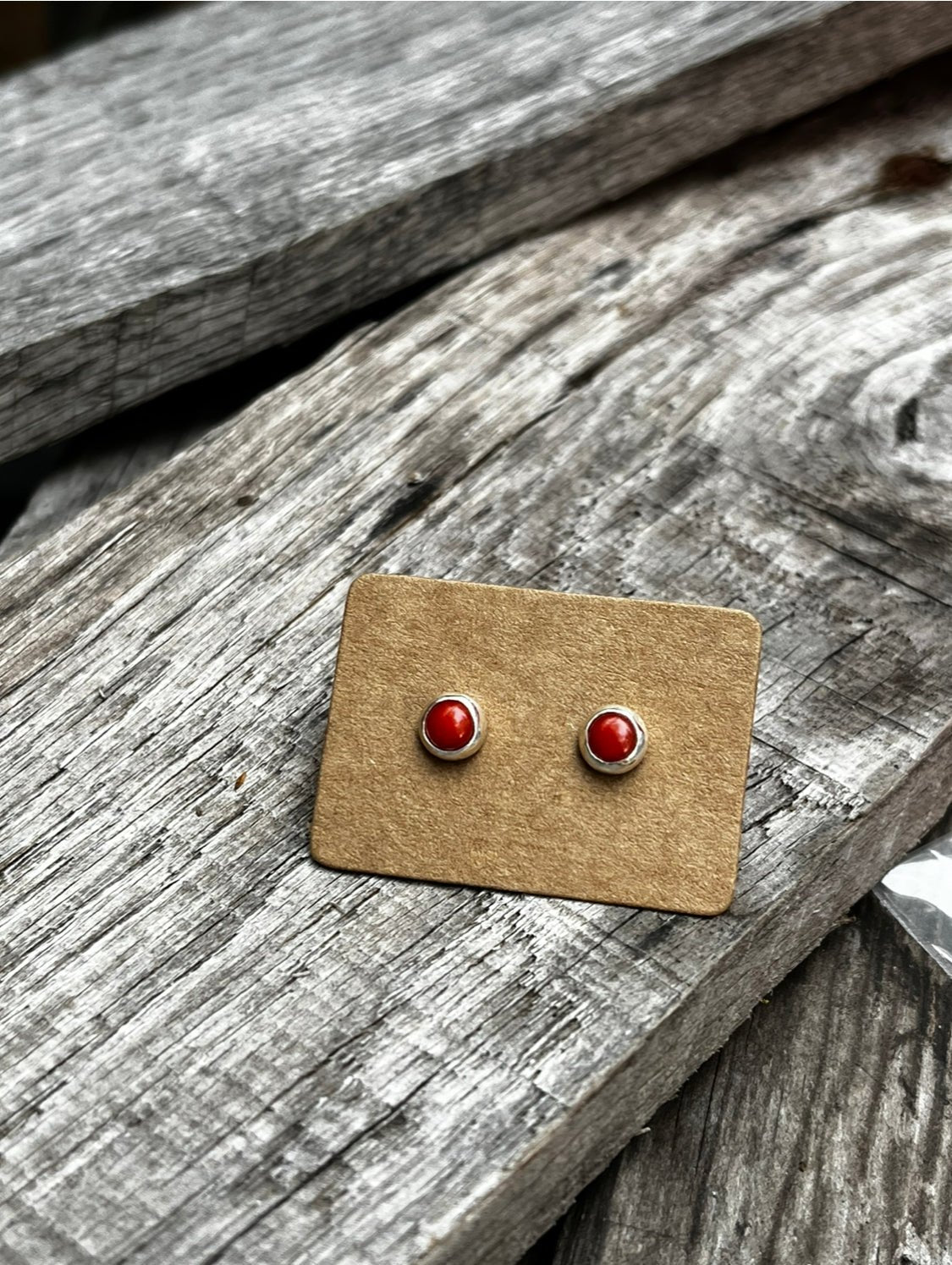 Minimalist round  red Mediterranean coral set in sterling silver with silver backs.