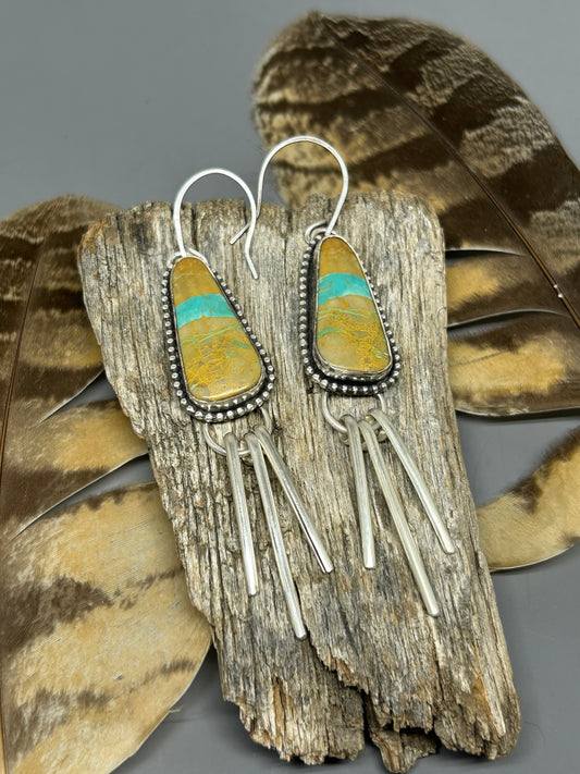 Royston turquoise set in sterling silver accented with silver bead wire and bold silver fringe.