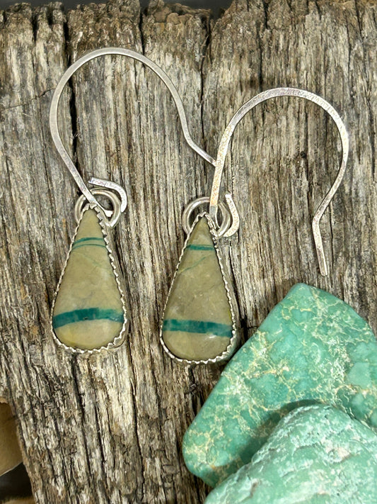 Teardeop shaped Royston ribbon turquoise cabochons set in sterling silver with sterling silver hammered ear wires.