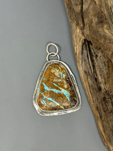 Large natural Royston turquoise cabochon set in a rustic sterling silver setting.