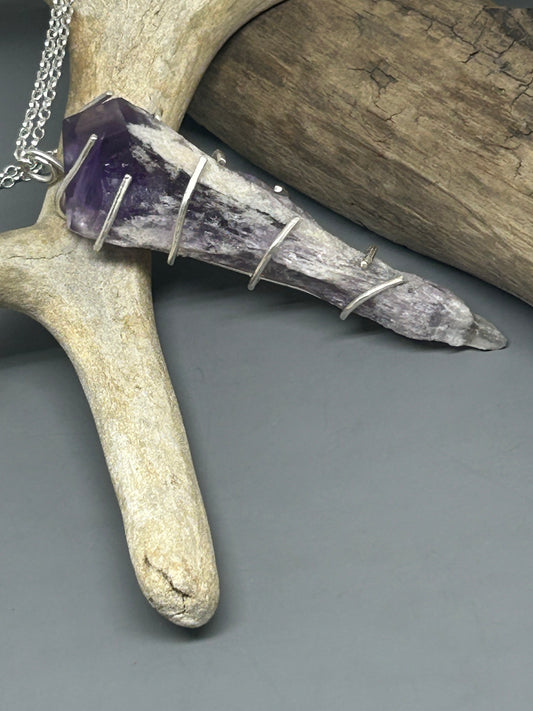 Amethyst crystal in sterling silver prong setting in sterling silver on an 18 inch sterling silver chain.