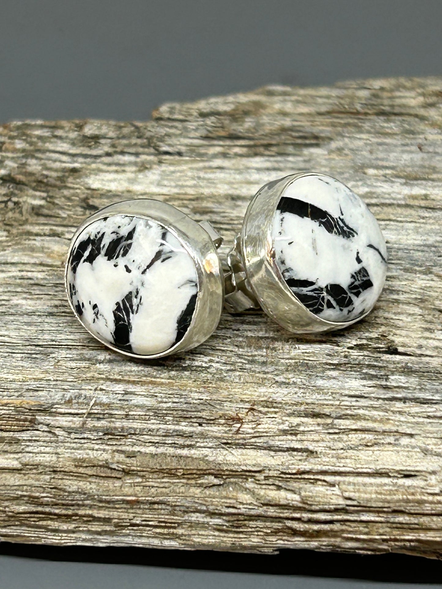 Round White Buffalo cabochons set in sterling silver with silver ear posts and backs. These southwestern earrings are 1/4 of an inch in diameter.