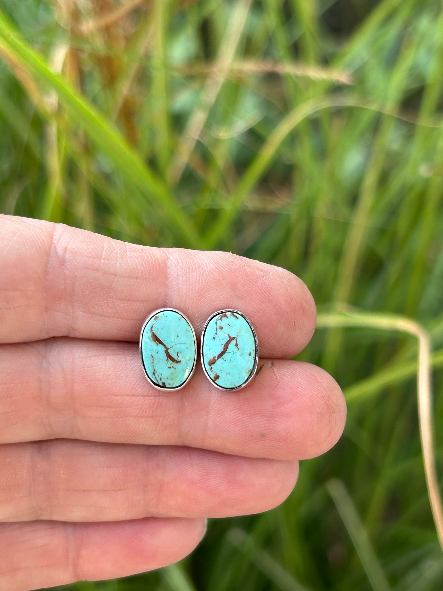 Kingman oval turquoise cabochons set in sterling silver with silver posts and ear backs.