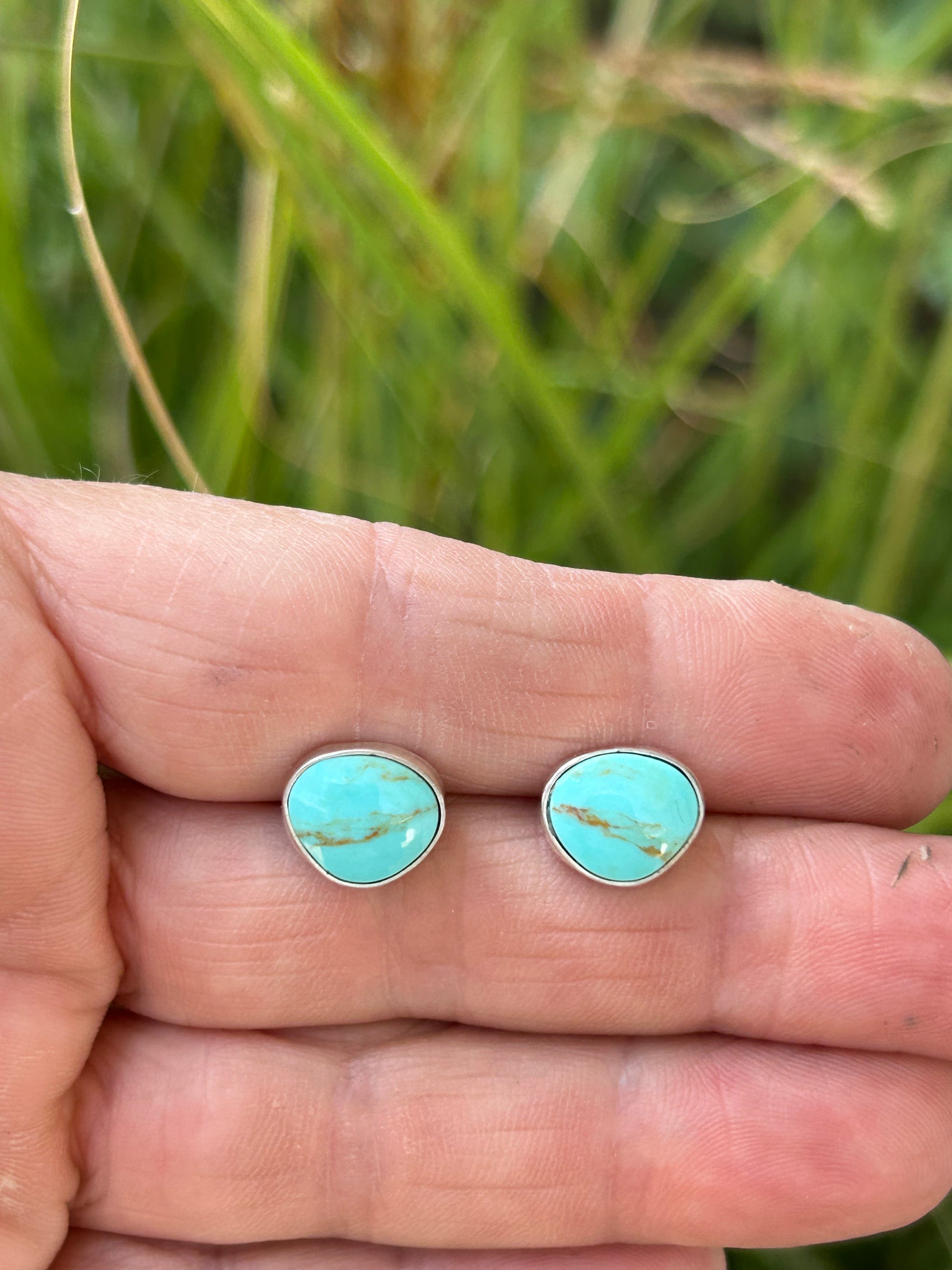 Genuine Kingman turquoise set in sterling silver with silver ear posts and backs.