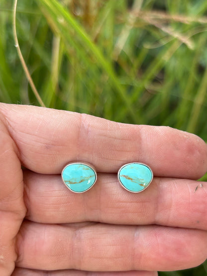 Genuine Kingman turquoise set in sterling silver with silver ear posts and backs.