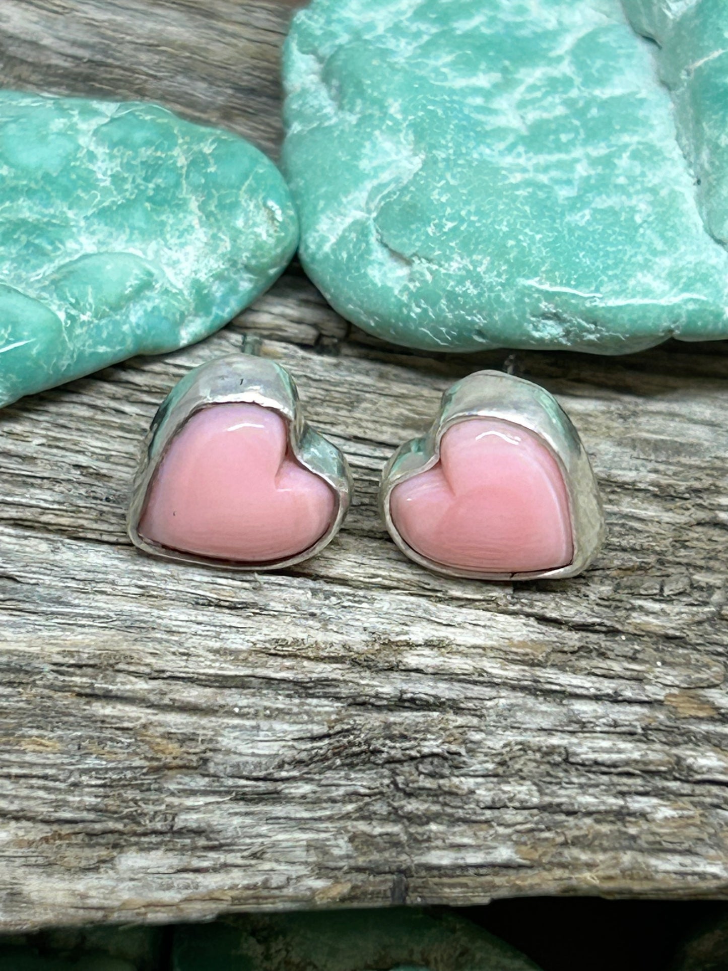 Natural pink conch heart shaped cabochons set in sterling silver with sterling ear posts and backs.