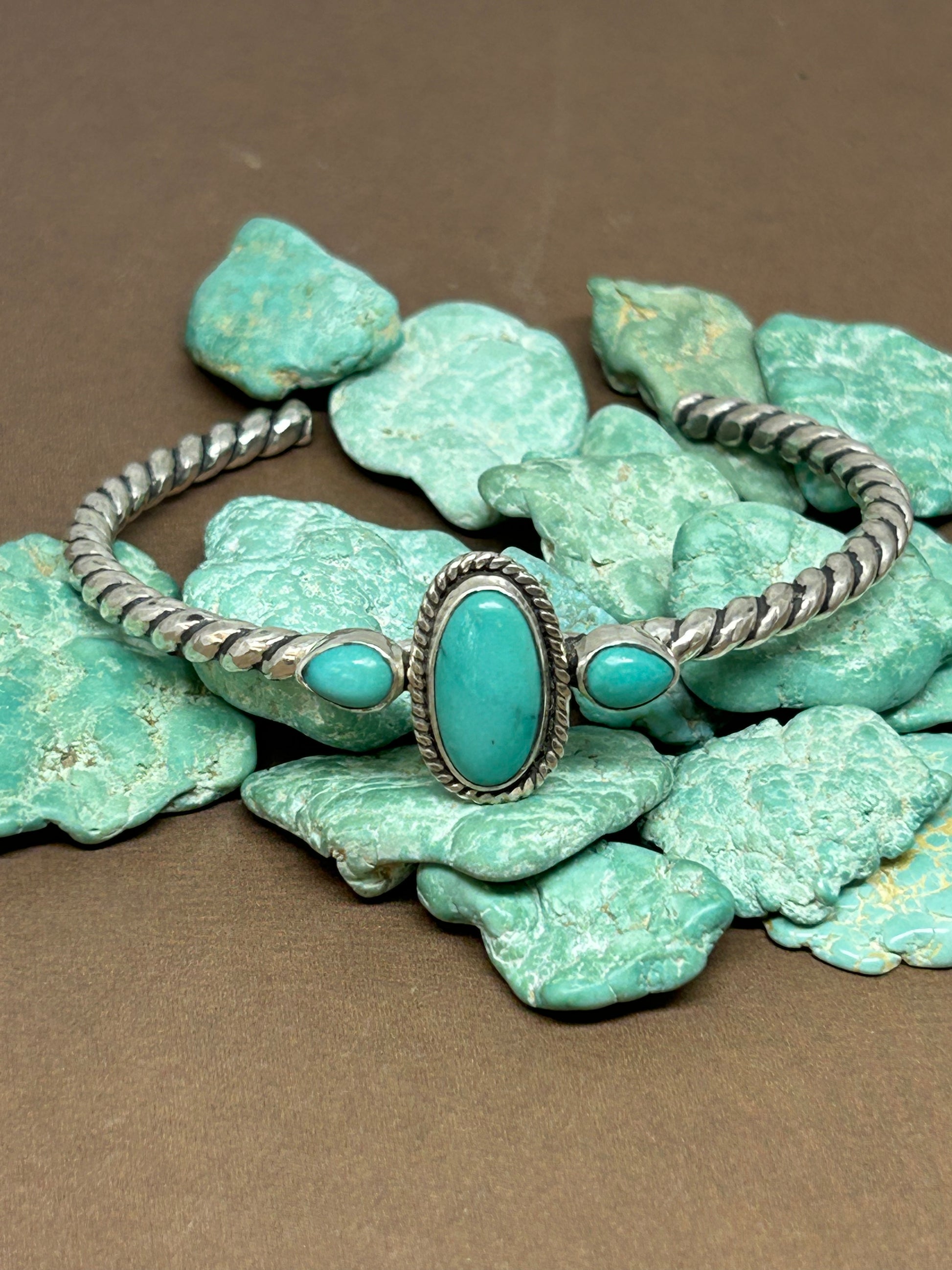 Rare McGinnis turquoise set in sterling silver on a beautiful twisted silver cuff which is adjustable.