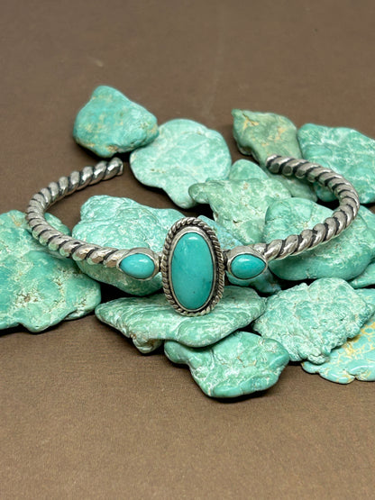 Rare McGinnis turquoise set in sterling silver on a beautiful twisted silver cuff which is adjustable.