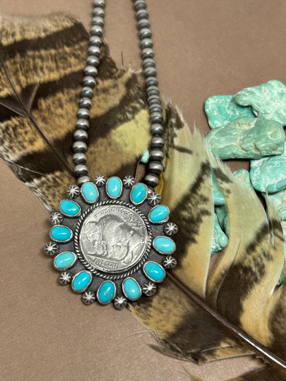 Antique buffalo head nickel set in sterlin gsilver accented with genuine rare sleeping beauty turquoise and sterling silver.