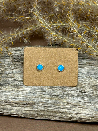 Four millimeter round blue ridge turquoise cabochons set in sterling silver with sterling posts and backs.
