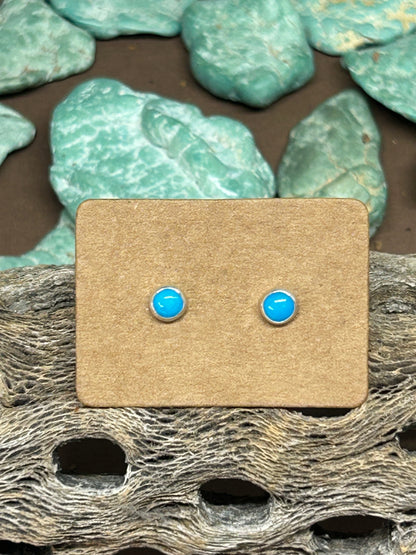 Four millimeter round blue ridge turquoiuse cabochons set in sterling silver with sterling posts and ear backs.