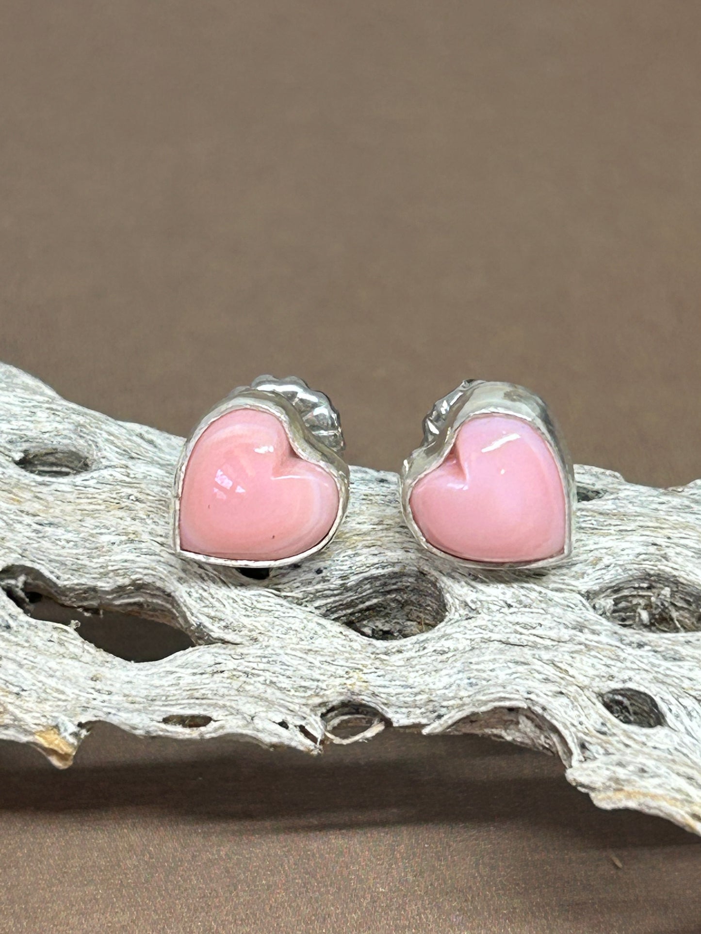 These pink conch shell earrings were made with sterling silver and natural pink conch shell. a perfect simple pop of color and light weight for everyday!