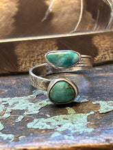 Load image into Gallery viewer, Two pieces of natural Royston turquoise set in distressed settings on an adjustable band.
