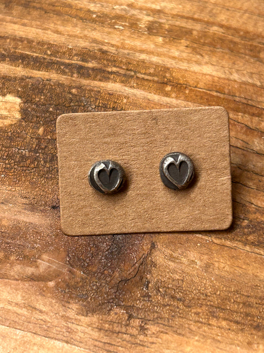 Sterling silver hammered silver heart earrings with sterling silver posts and ear nuts. Made by my 11 year old grandson.