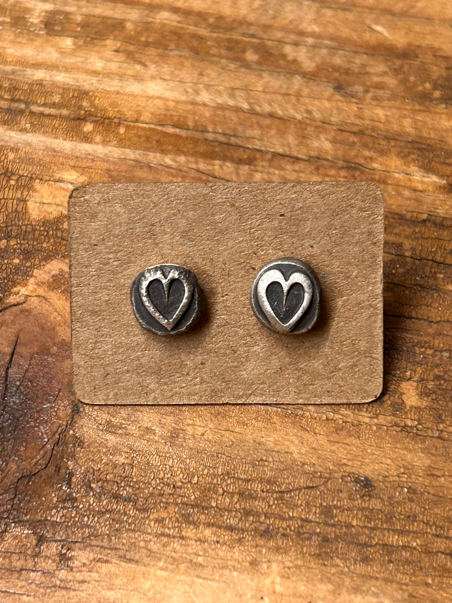 Sterling silver heart earrings with a soft patina, silver ear posts and backs.