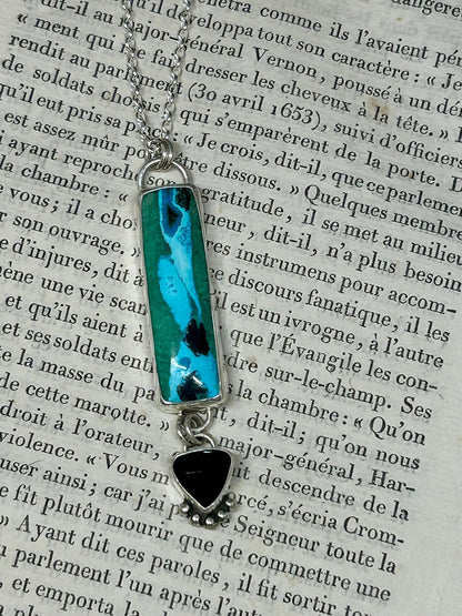 This Chrysocolla Malachite Tenorite And Black Onyx necklace is a heirloom piece and all stones are set in sterling silver and hang on an 18 inch sterling silver chain,