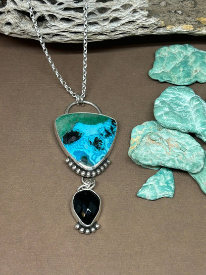 This Chrysocolla Tenorite Malachite Black Onyx Necklace is a statement piece. Stones are set in sterling silver on an 18 inch sterling silver chain