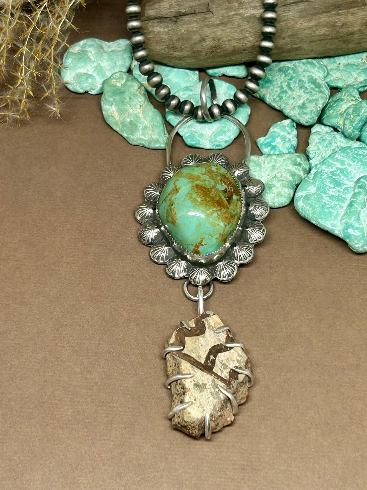 Evans Turquoise pendant with Anasazi Pottery Talisman set and bordered in genuine Sterling Silver. 