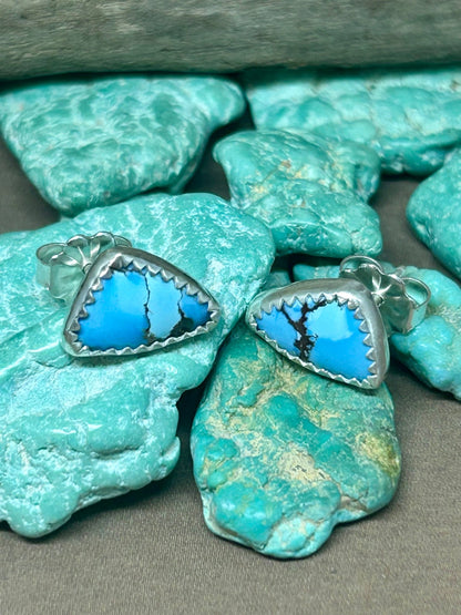 Triangular Golden Hills Turquoise stud earrings set in genuine sterling silver. Light blue and black.