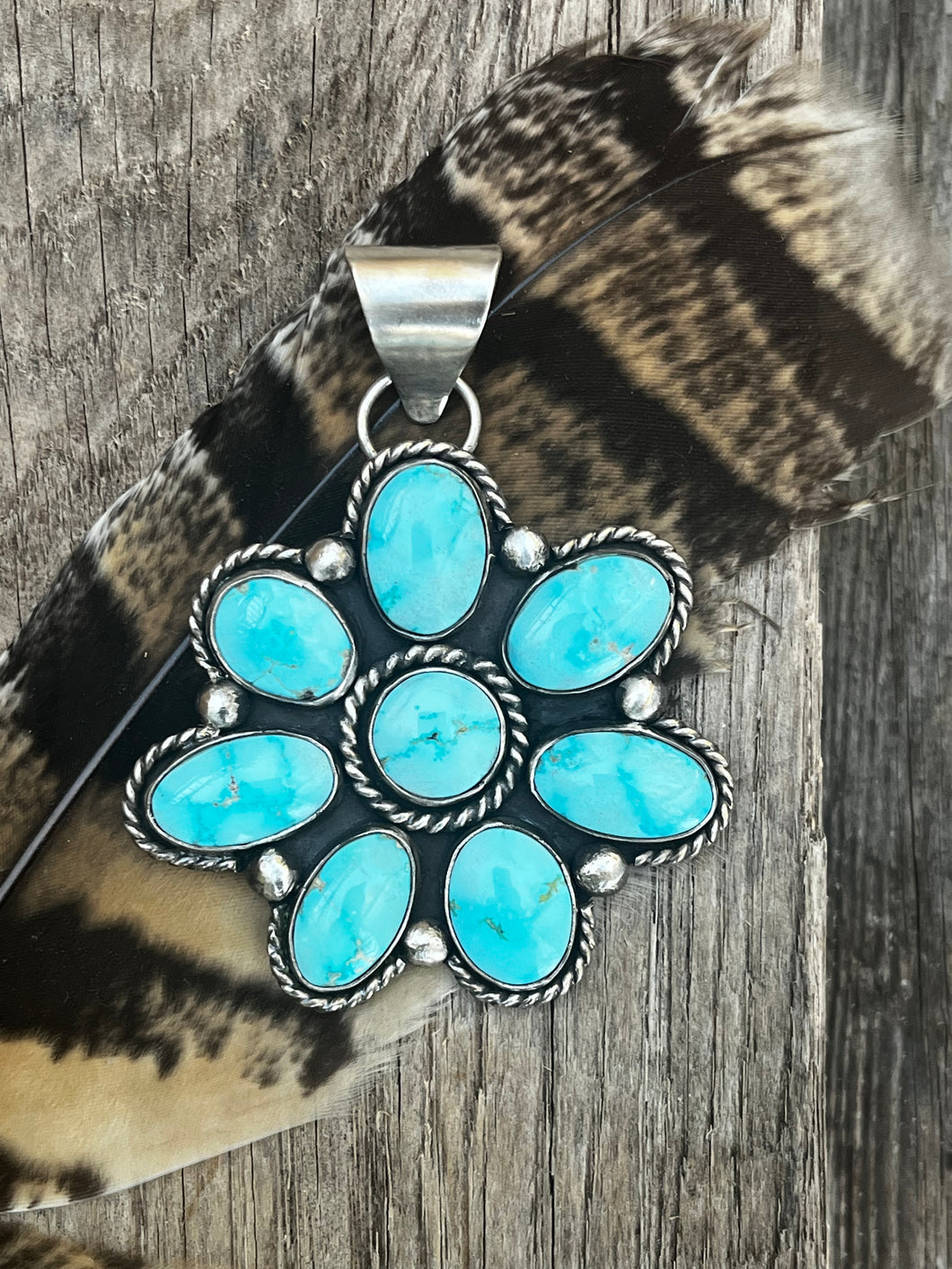 Natural Campitos Turquoise (8 pieces) set in sterling silver accented with twist wire and silver balls,.  This cluster pendant was handmade by Taylor Made Silver.