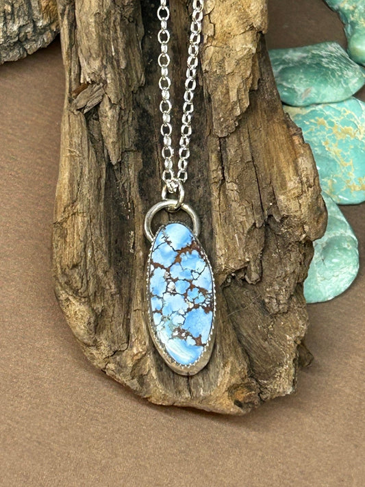 This lavender turquoise cabochon is set in a simple sterling silver setting on an 18 inch sterling silver chain. 
