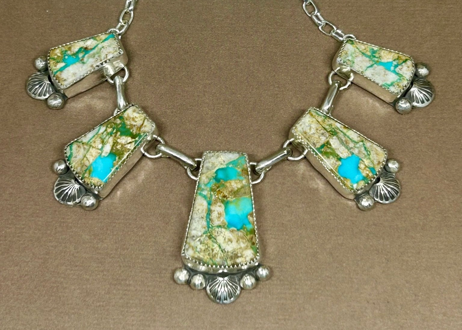 Five pieces of Montezuma Royston Turquoise blue and green set in sterling silver with silver accents. 16 inches long with a 2 inch extension. 