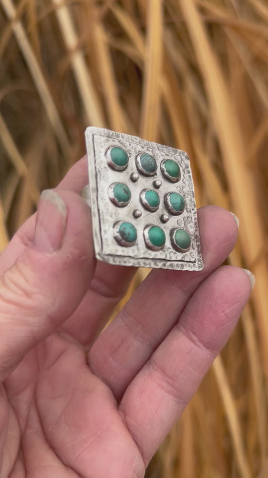 Nine pieces of Hubei turquoise set in sterling silver on an adjustable sterling silver band.