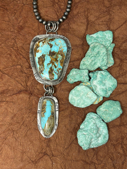 This royston tuff gurlz necklace was handcrafted with two royston turquoise stones set in sterling silver in a rustic setting.