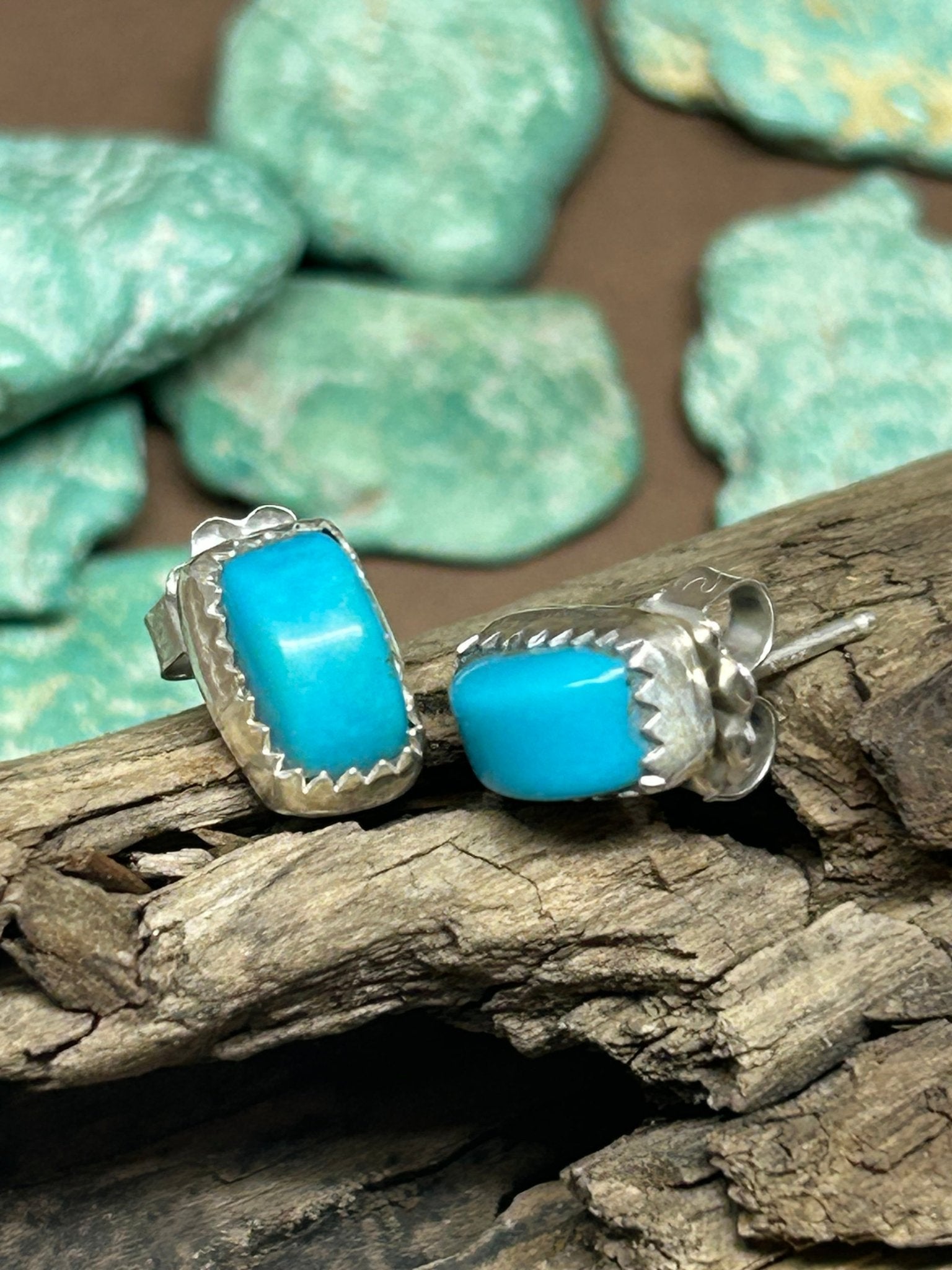 Sleeping Beauty turquoise set in a simple sterling silver setting with silver posts and backs.