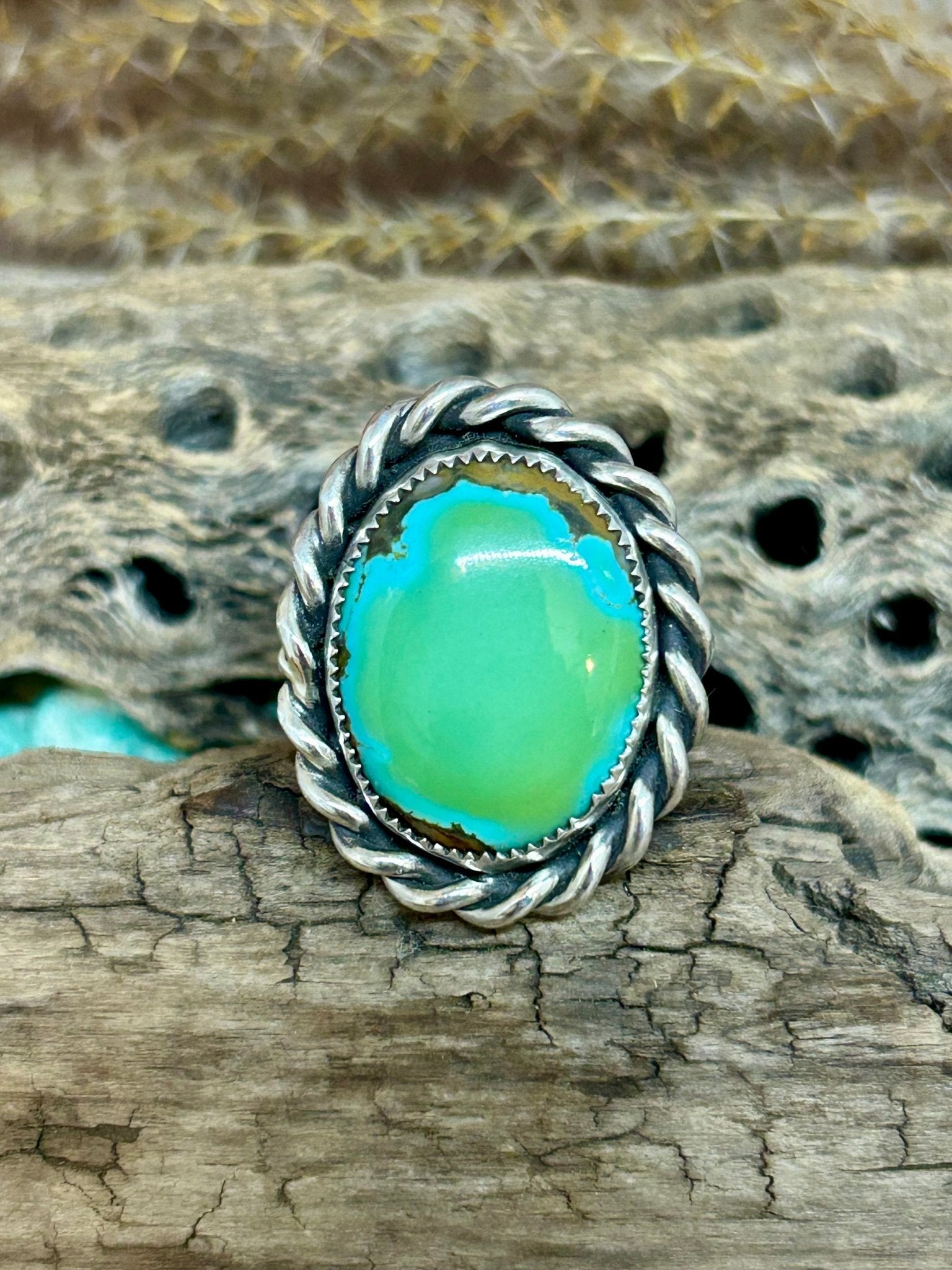 This spernova turquoise is set in sterling silver with hand twisted thick sterling wire accent on a wide sterling silver size 7.5 band.