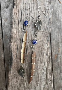 Asymmetrical long earrings made with lapis gemstones, wooly mammoth tusk and ammonites set in sterling silver.