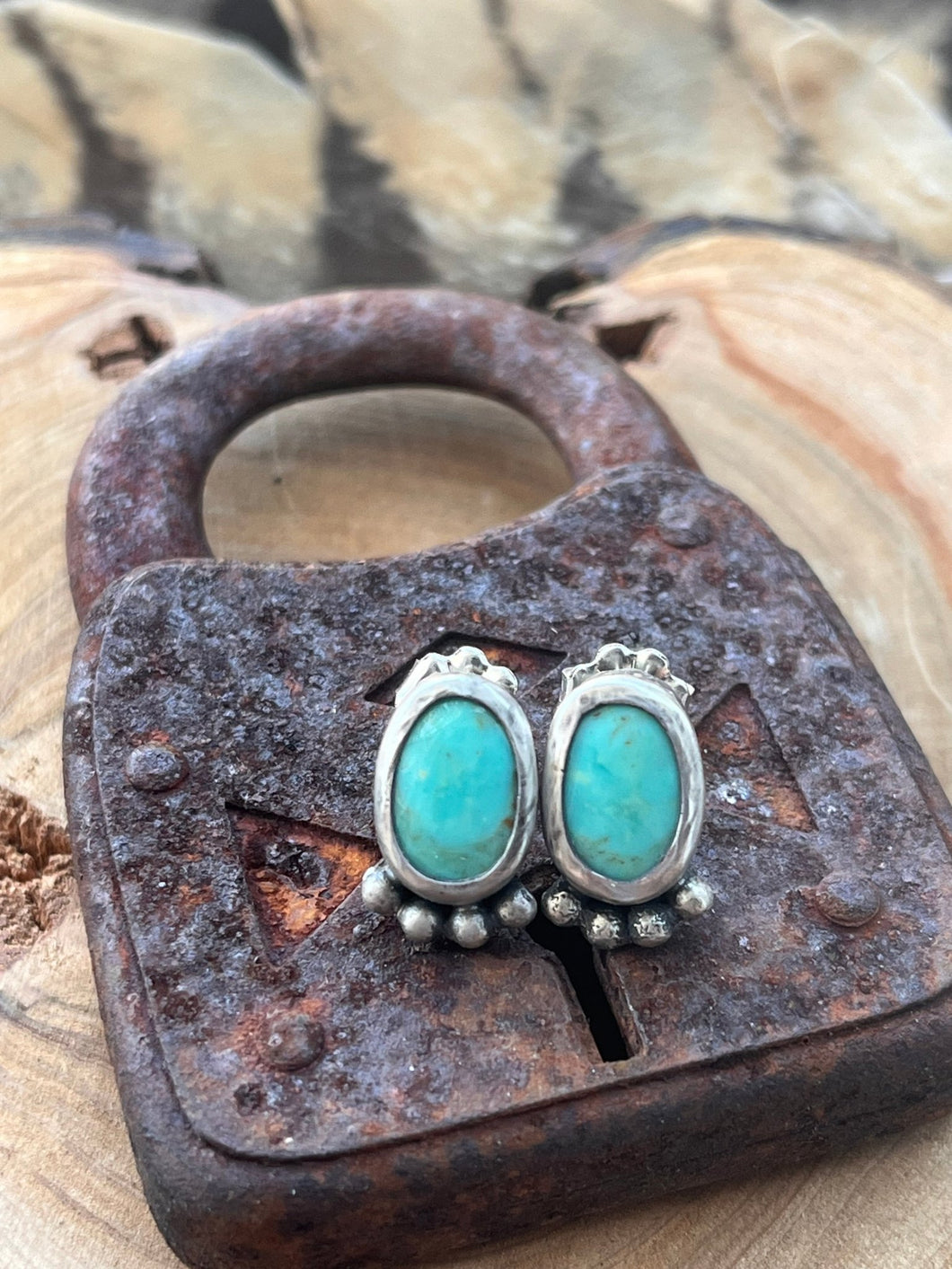 Oval blue green turquoise cabochons set in sterling silver accented with silver balls,  The posts on these stud earrings are sterling silver and the ear nuts are sterling silver.  These stud earrings are handmade by Taylor Made Silver.