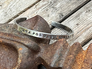 sterling silver affirmation cuff.  The phrase unapologetically me hand stamped in the cuff.  This cuff is 6 inches long with a 1 inch gap, handmade by Taylor Made Silver.