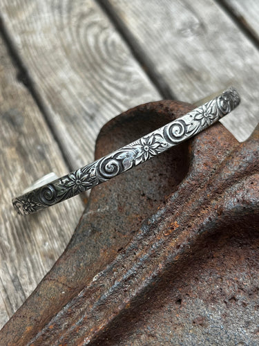 Flower patterned sterling silver stacking cuff bracelet.  This cuff is 6 inches long with a 1 inch gap.  Handmade by Taylor Made Silver.