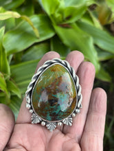 Load image into Gallery viewer, Large teardrop shaped green and brown Patagonia turquoise cabochon set in sterling silver accented with sterling silver twist wire, silver balls and casts.  This pendant is handmade by Taylor Made Silver.
