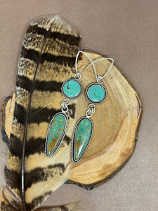 Two pieces of natural Sonoran turquoise set in sterling silver.  These southwestern style dangle earrings are 3.75 inches long.