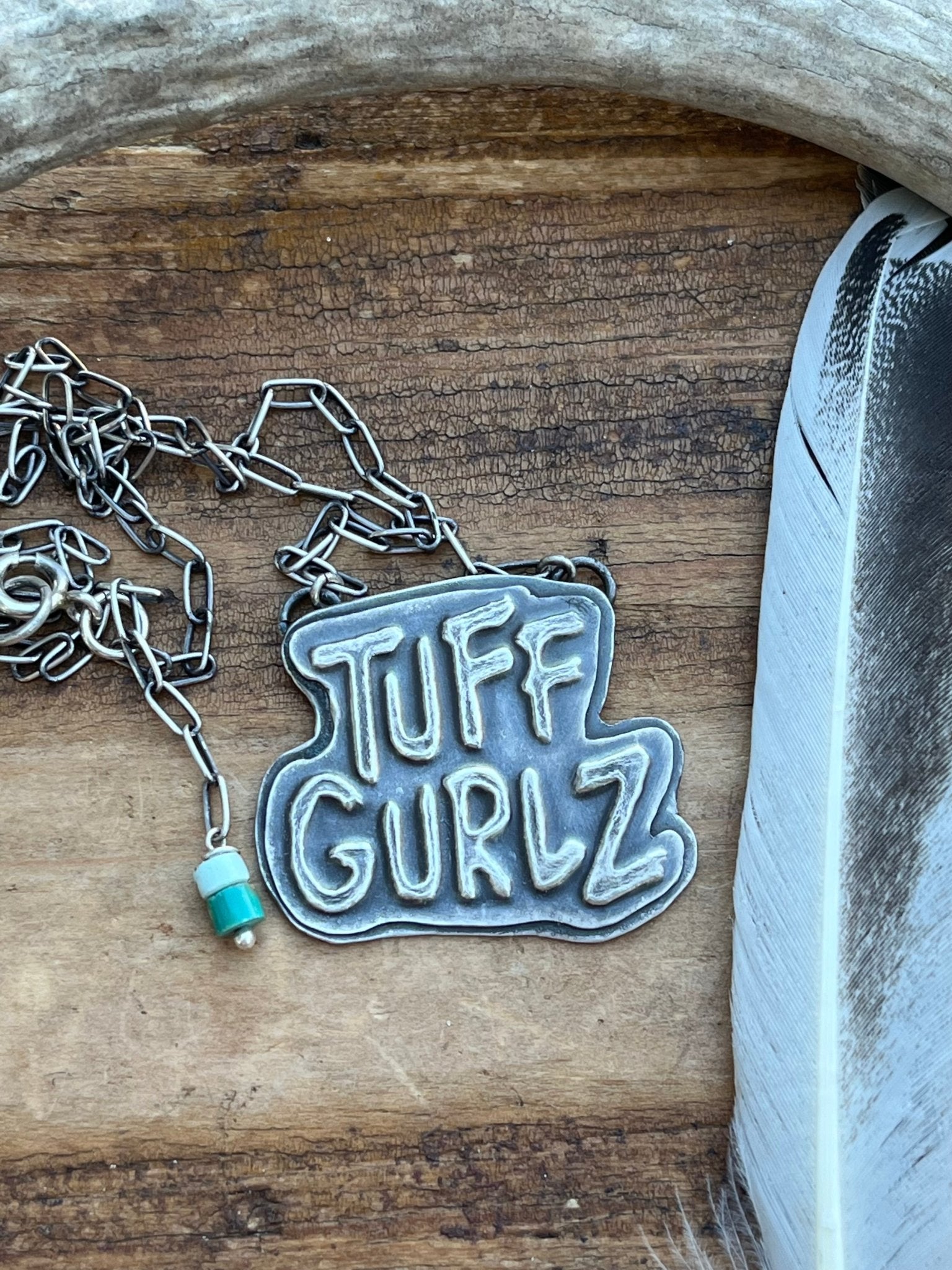 Tuff Gurlz Logo necklace 16 inches long with royston turquoise beads.  Handmade by Taylor Made Silver.